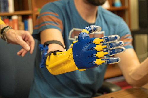 The first of 3-D printed arm prosthetics made by Sr. Gacnik and Bio-Chem Club co-presidents Emily Dorn and Carlie Wetzel